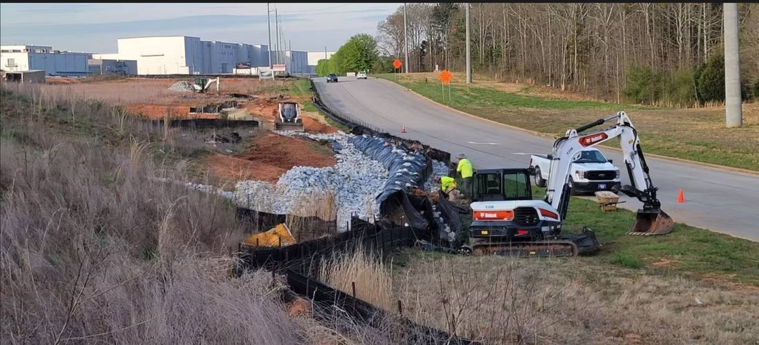 Heavy equipment working on a large industrial site